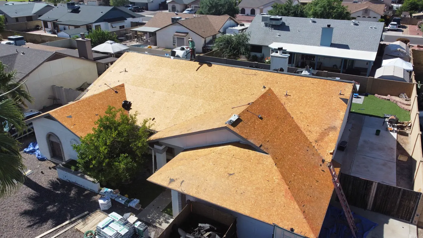 Aerial view of shingle installation in progress by the A1 Roofing crew