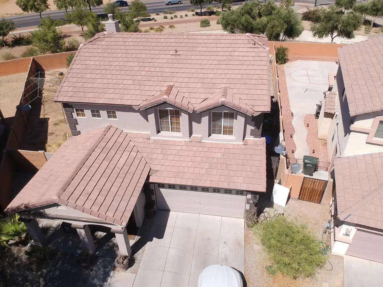 Drone photograph of a two-storey home with a new tile roof by A1 Roofing Solutions